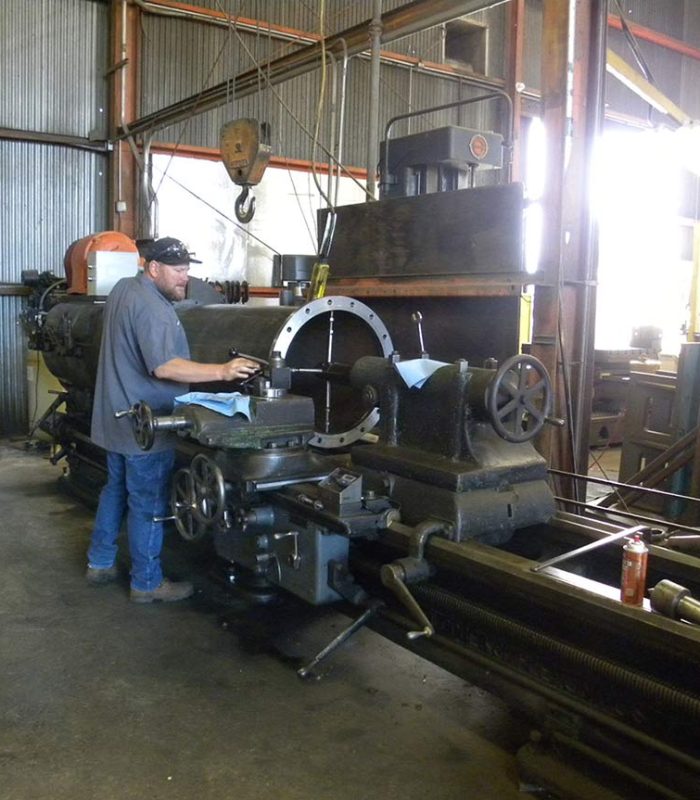 Machine shop floor with fabrication equipment for pump parts
